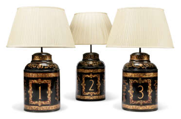 A SET OF THREE BLACK AND GILT TOLE TEA-CANISTER TABLE LAMPS