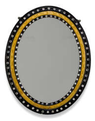 AN IRISH VICTORIAN PARCEL-GILT AND EBONISED GLASS-MOUNTED OVAL MIRROR