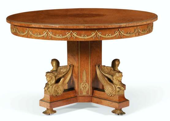 A FRENCH ORMOLU-MOUNTED BURR-AMBOYNA CIRCULAR EXTENSION DINING TABLE - photo 1