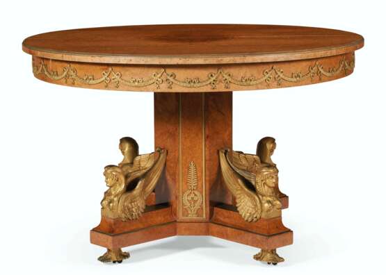 A FRENCH ORMOLU-MOUNTED BURR-AMBOYNA CIRCULAR EXTENSION DINING TABLE - photo 2
