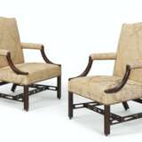 A PAIR OF EARLY GEORGE III MAHOGANY LIBRARY ARMCHAIRS - photo 1