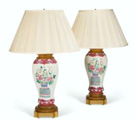 A MATCHED PAIR OF CHINESE EXPORT FAMILLE ROSE PORCELAIN VASES, MOUNTED AS LAMPS