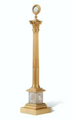 AN EARLY VICTORIAN ORMOLU AND SULPHIDE GLASS COMMEMORATIVE COLUMN 