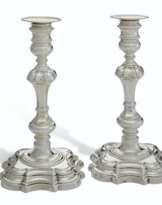 A PAIR OF TWO GEORGE II SILVER CANDLESTICKS