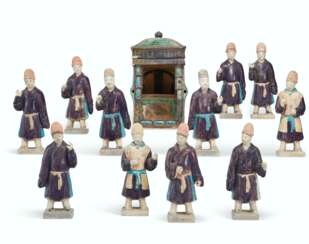 ELEVEN CHINESE TURQUOISE AND AUBERGENE-GLAZED POTTERY FIGURES OF ATTENDANTS AND A MODEL OF A SEDAN CHAIR