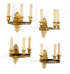 A SET OF FOUR EMPIRE ORMOLU AND PATINATED-BRONZE THREE-BRANCH WALL-LIGHTS