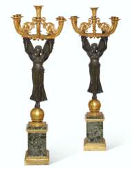 A PAIR OF EMPIRE ORMOLU AND PATINATED BRONZE SIX-BRANCH CANDELABRA