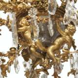 A LARGE FRENCH ORMOLU, CUT AND MOLDED GLASS THIRTY-LIGHT CHANDELIER - photo 2