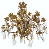 A LARGE FRENCH ORMOLU, CUT AND MOLDED GLASS THIRTY-LIGHT CHANDELIER - фото 3
