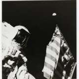 NASA. Astronaut Harrison Schmitt with the Earth above the US flag, December 7-19, 1972 - photo 2