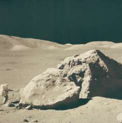 Exploring the Moon: Astronaut Harrison Schmitt beside Tracy's Rock; Schmitt shakes lunar soil from his rake; Schmitt at the lunar rover, December 7-19, 1972