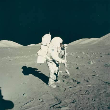 NASA. Exploring the Moon: Astronaut Harrison Schmitt beside Tracy's Rock; Schmitt shakes lunar soil from his rake; Schmitt at the lunar rover, December 7-19, 1972 - фото 4