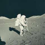NASA. Exploring the Moon: Astronaut Harrison Schmitt beside Tracy's Rock; Schmitt shakes lunar soil from his rake; Schmitt at the lunar rover, December 7-19, 1972 - photo 4