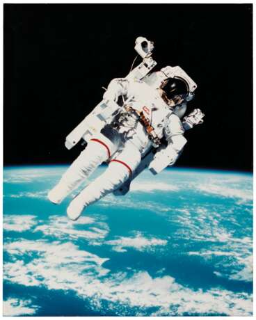 NASA. The first untethered space flight: astronaut Bruce McCandless II using the Manned Manoeuvering Unit in space, February 7, 1984 - photo 2