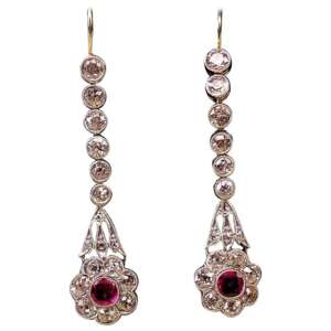 ART NOUVEAU DROP EARRINGS WITH NUMEROUS BRILLIANT-CUT DIAMONDS AND WITH A RUBY OCCUPIED