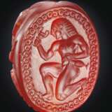 A GREEK CARNELIAN SCARAB WITH A RUNNING YOUTH - photo 1