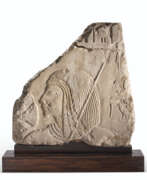Bas-relief. AN EGYPTIAN LIMESTONE RELIEF FRAGMENT