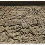A WALNUT RELIEF PANEL DEPICTING THE ‘BATTLE OF THE SPURS’, THE VICTORY OF EMPEROR MAXIMILIAN I AND KING HENRY VIII OF ENGLAND OVER THE FRENCH IN 1513, NEAR GUINEGATE - photo 1