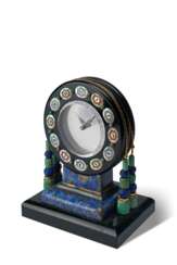 BLACK, STARR & FROST, NEW YORK, MADE BY RUBEL FRÈRES, PARIS, LAPIS LAZULI, BLACK ONYX, ROCK CRYSTAL, MOTHER-OF-PEARL, GOLD AND PLATINUM MYSTERY CLOCK INSPIRED BY THE AZTEC SUN STONE