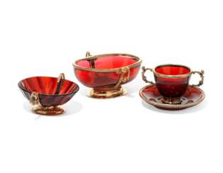 TWO GERMAN SILVER-GILT MOUNTED RUBY-GLASS TWO-HANDLED BOWLS AND A CUP AND SAUCER