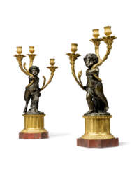 A PAIR OF FRENCH ORMOLU AND PATINATED-BRONZE THREE-LIGHT CANDELABRA