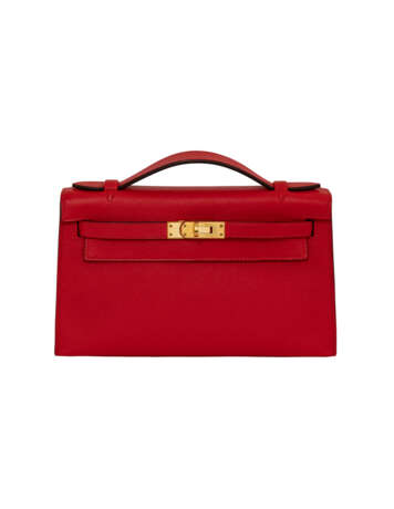 HERMÈS. A ROUGE TOMATE EPSOM LEATHER KELLY POCHETTE WITH GOLD HARDWARE - photo 1