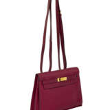 HERMÈS. A ROUGE GRENAT SWIFT LEATHER KELLY DANSE WITH GOLD HARDWARE - photo 2