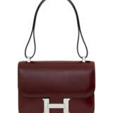 HERMÈS. A ROUGE H CALF BOX LEATHER CONSTANCE 24 WITH PALLADIUM HARDWARE - photo 1