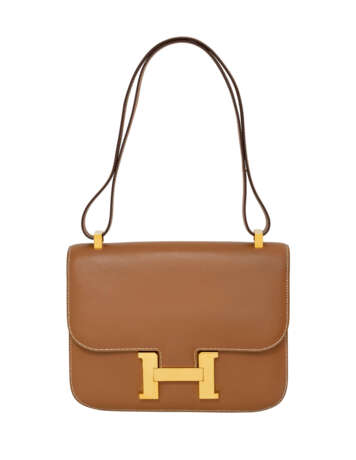 HERMÈS. A GOLD CHAMONIX LEATHER CONSTANCE 24 WITH GOLD HARDWARE - photo 1