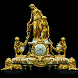 A FRENCH ORMOLU AND MARBLE THREE-PIECE CLOCK GARNITURE - фото 2