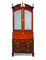 A GEORGE II BRASS-MOUNTED AND PARCEL-GILT MAHOGANY BUREAU-CABINET