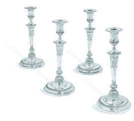A SET OF FOUR GEORGE III SILVER CANDLESTICKS