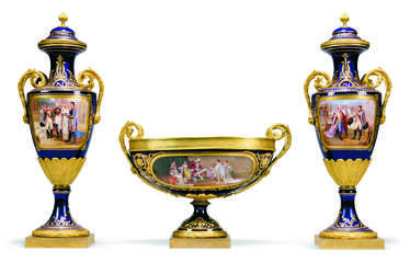 A FRENCH ORMOLU-MOUNTED SEVRES-STYLE BLUE-GROUND PORCELAIN NAPOLEONIC THREE-PIECE GARNITURE