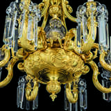 A FRENCH ORMOLU AND CUT-CRYSTAL GLASS TWELVE-LIGHT CHANDELIER - photo 4