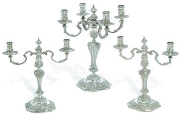 A PAIR OF ELIZABETH II SILVER TWO-LIGHT CANDELABRA AND A MATCHING FOUR-LIGHT CANDELABRUM