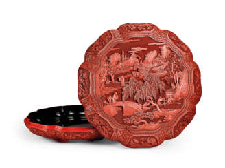 AN EXCEPTIONALLY WELL CARVED LARGE CINNABAR LACQUER OCTAGONAL LOBED BOX AND COVER
