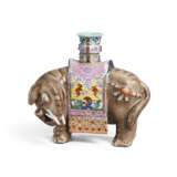 A FAMILLE ROSE ‘ELEPHANT AND VASE’ CANDLE HOLDER - photo 1