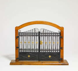Model of a paled metal gate in wooden frame