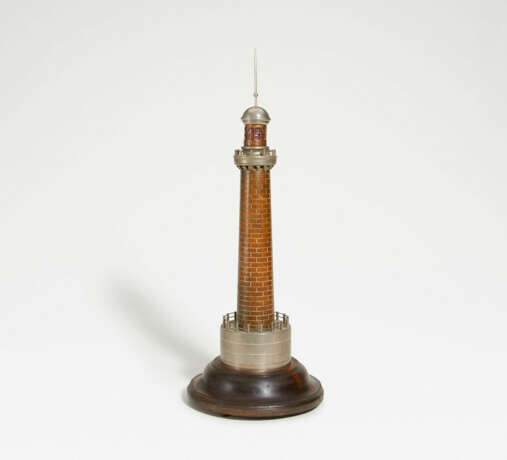 France. Metal lighthouse on wooden pedestal - фото 1