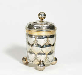 Exceptionally large, partially gilt silver tankard with gilt interior, ball feet and heart-shaped lobes