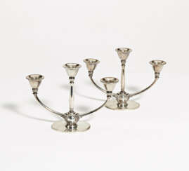 Pair of three-armed silver candlesticks