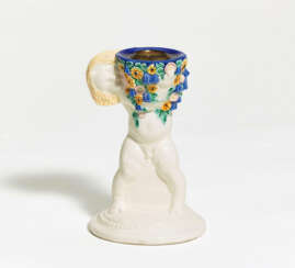 Putto-shaped ceramic candlestick