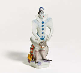 Porcelain figurine of a harlequin with drum