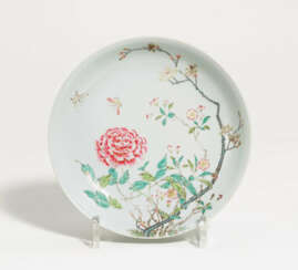 Dish with butterflies above a flowering peony
