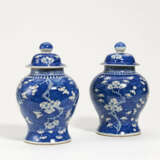 Pair of lidded vases with flowering plums on blue fond - photo 1
