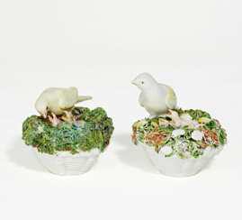 Two porcelain bird nests with freshly hatched chicks