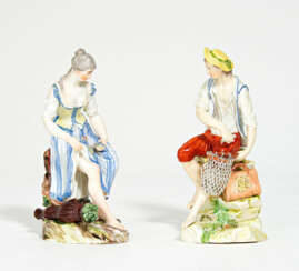 Porcelain figurines of fisherman and fisherwoman