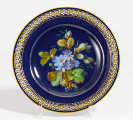 Porcelain plate with violet coloured blossoms