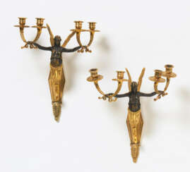 Pair of partially gilt bronze empire wall appliques with victories