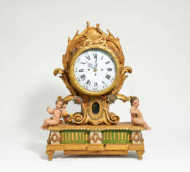 Wooden rococo commode clock with musical mechanism